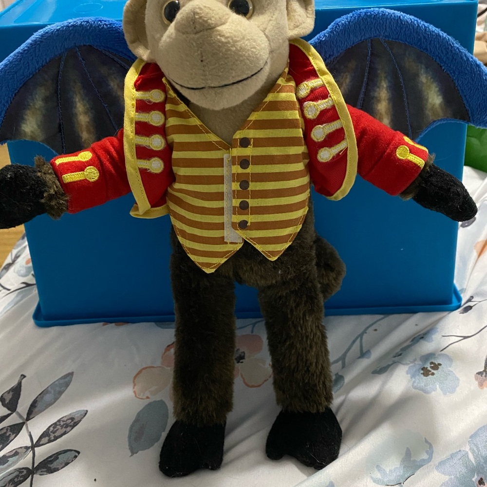 Red and Yellow Stuffed Monkey with Welcoming Pose